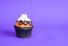 Variety Of Halloween Cupcakes On Background.
