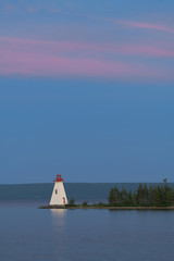 Fototapete - Kidston Island Lighthouse at twilight in Baddeck, Nova Scotia