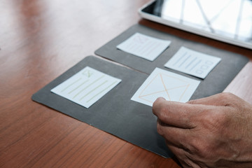 user experience, ux designer designing web on tablet layout. ui planning mobile application. develop