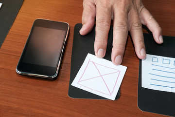 user experience, ux designer designing web on smartphone layout. ui planning mobile application. dev