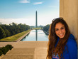 Young girl posing in front of the Lincoln Memorial Reflecting Pool and Washington Monument in Washington DC, USA