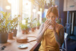© Andrey Cherlat - beautiful tattooed ginger girl in cafe