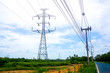 © Thanunchakorn - High voltage electricity pole with clear blue sky landscape