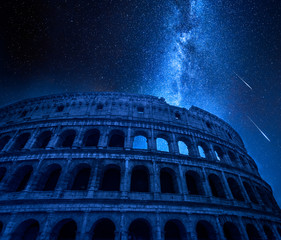 Wall Mural - stunning colosseum in rome at night with falling stars, italy