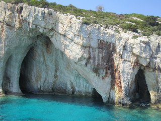 blue sea cliff cave