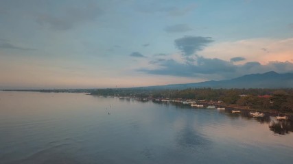 Wall Mural - aerial beautiful sunset lagoon with calm water at northshore of bali island