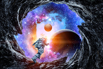 Wall Mural - Running spaceman and galaxy. Mixed media