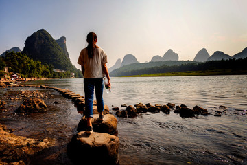 Stepping stone crossing on li river Yangshuo