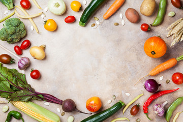 Frame of autumn harvest. Vegetables and root on kitchen table top view.