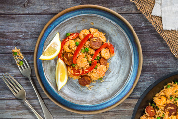 Canvas Print - Spanish paella with prawns, chicken, chorizo and red pepper - top view