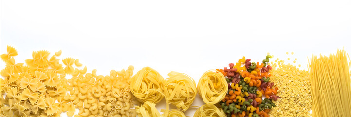 Italian pasta of various kinds on a white background. Flat lay, top view. Laid out in line. Banner