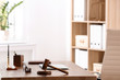 © New Africa - Table with judge gavel in lawyer's office