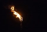 Fototapeta  - Burning Torch in the Night at black background