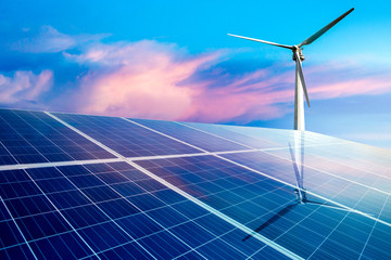 wind turbines and solar panels closeup on sky background