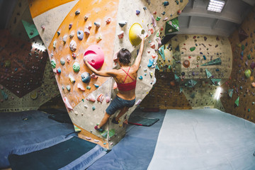 Poster - The climber trains on the climbing wall.