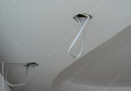Hole In A False Ceiling With A Protruding Electric Wire