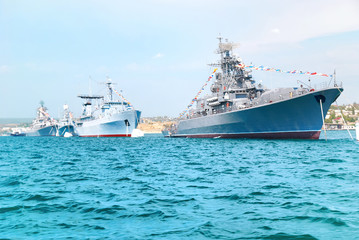 Wall Mural - Military navy ships in order on blue sea