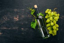 A Bottle Of White Wine. Wine. Top View. On A Black Background. Free Space For Text.