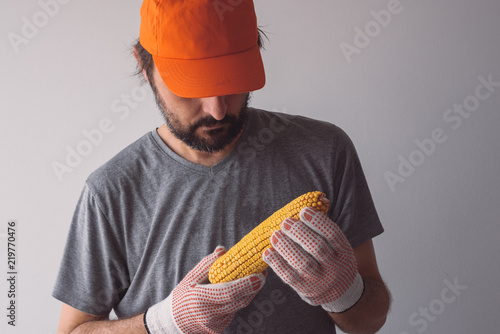 Fotografie, Obraz Proud authentic farmer posing with corn on the cob