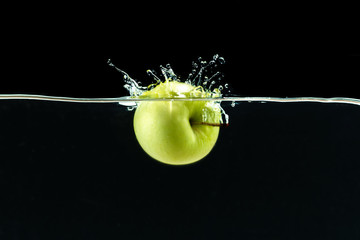 Wall Mural - Green apple under water