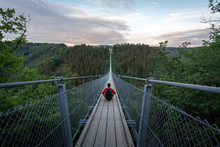 Traveler On The Suspension Bridge In Germany. Geierlay, Morsdorf.