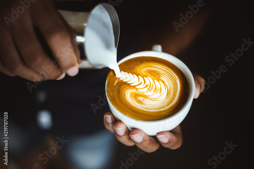 Barista making a cup of coffee latte art. Tableau sur Toile