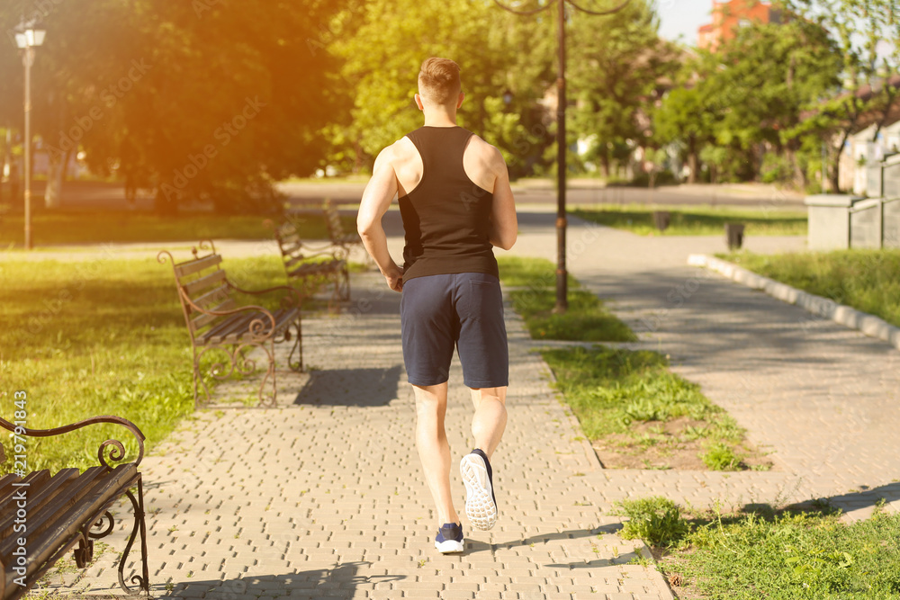 Sporty man running in park
