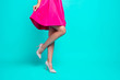 © deagreez - Close-up picture of young girl legs, pink fuchsia short mini dress, walking in high heels shoes. Copy space. Isolated over bright vivid turquoise teal background