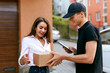 © puhhha - Express Delivery Service. Courier Delivering Package To Woman