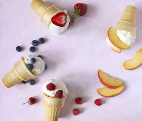 Wall Mural - Vanilla ice cream flavor in cones with summer berries and fruits