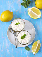 Wall Mural - Limoncello - italian Dessert.  Lemon Cheesecake Mousse with Whipped Cream in cups. Summer dessert.