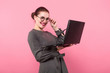 © Ivan Traimak - Businesswoman with hair bun and laptop