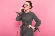 © Ivan Traimak - Businesswoman with hair bun and telephone