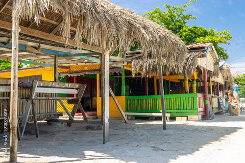 Thatch roof shops along the Seven Mile Beach in Negril, Jamaica Poster Mural XXL