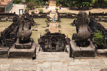 Ancient temple stone monument of Roluos temples, Cambodia. Barong lion statue on top of Bacong temple.