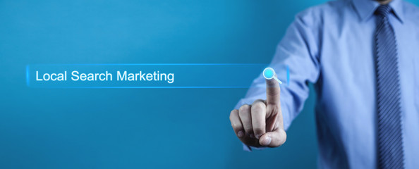 Wall Mural - Businessman pressing Local Search Marketing button. Business concept