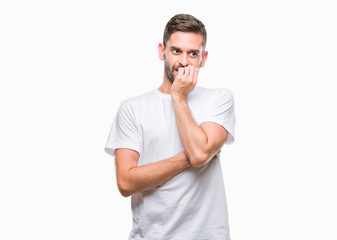 Sticker - Young handsome man over isolated background looking stressed and nervous with hands on mouth biting nails. Anxiety problem.