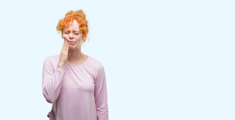 Poster - Young redhead woman touching mouth with hand with painful expression because of toothache or dental illness on teeth. Dentist concept.