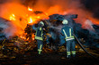firefighters in the night work extinguish the fire