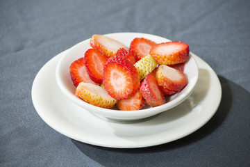 Sticker - Sliced strawberries on the plate - Fragaria. Top view