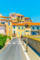 Wall Mural - View of a narrow street in the center of Antibes, France