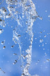 © schankz - Splashing water with drops on the sky background