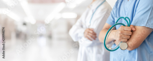 Fotomural Surgeon and anesthetist doctor ER team with medical clinic room background for e