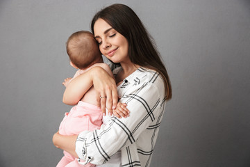 Wall Mural - Portrait of a delighted young mother