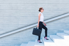Business Woman With Laptop On Stairs