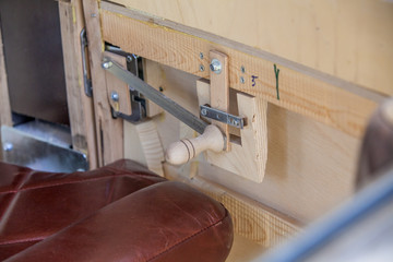 Specialy shaped wooden handle that will help people with opening the window of the home made wooden car.