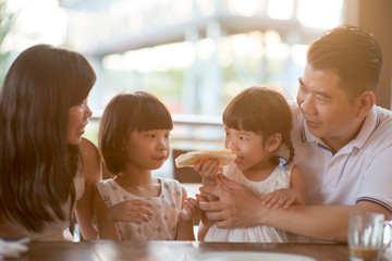 Asian family at cafe