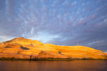 Dawn light and skyscape over rock