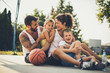 © liderina - Happy family at basketball playground have fun.