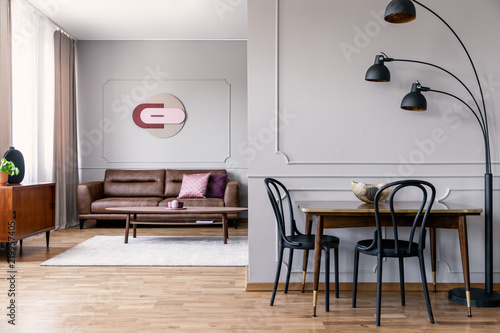 Real Photo Of Metal Lamp Standing Next To Dining Table With